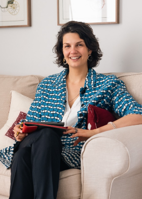 Leonor de Escoriaza seated and smiling